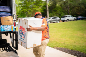 Local movers loading a moving truck in Dallas, TX