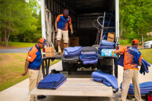 group of movers loading their truck providing services such as Home Movers, Local Movers, and Long Distance Movers in McDonough, Georgia