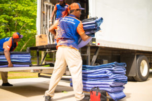 Moving Company Employees moving tarps for a safe move in Smyrna, GA