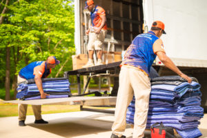 Atlanta interstate mover unloads moving protection pads from the moving truck