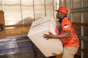 Man Moving Box in Truck with a Moving Company in Brookhaven, GA