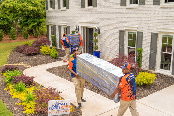 Movers in Atlanta, carrying a couch