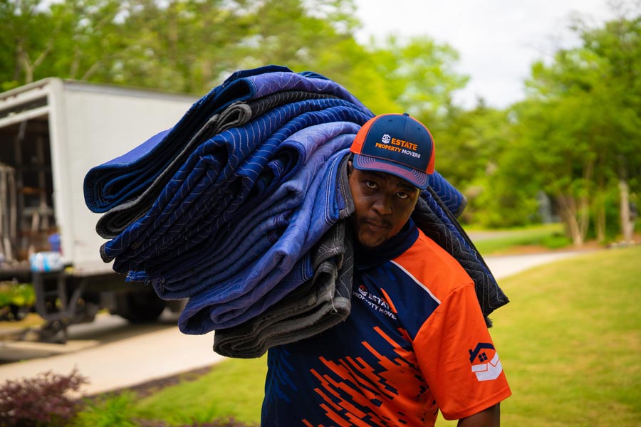 Office mover walking with protective blankets