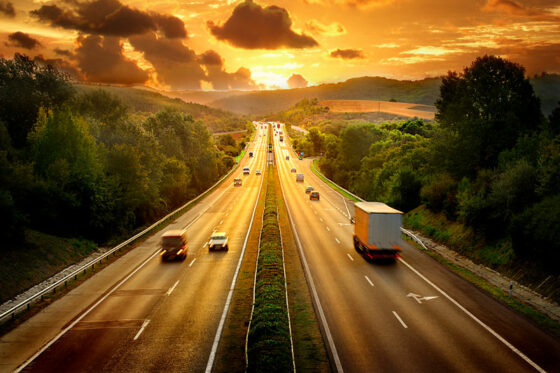 Interstate mover in Fulton County, GA, traveling US highway in the sunset