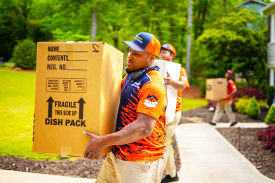 Men with boxes performing Commercial Mover in Brookhaven, Buckhead, Fulton County, Marietta, and Surrounding Areas