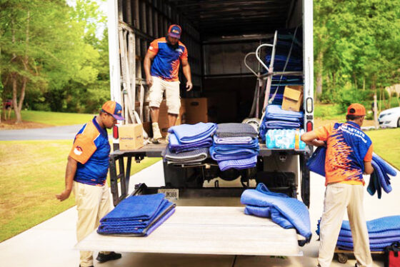 Long-distance movers in Austin loading a moving truck