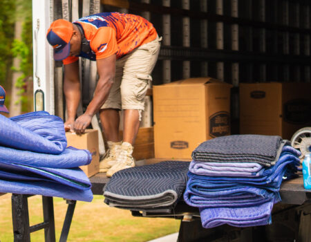 workers loading boxes in a truck while providing services like Corporate Movers in Duluth