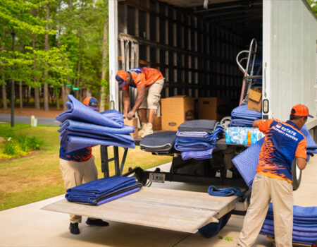 movers loading a truck and providing services such as Relocation Services and Commercial Office Mover in Johns Creek, GA