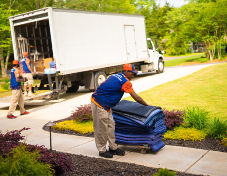 team of professional movers loading up a box truck while providing services such as Corporate Movers and Commercial Relocation Services in Kennesaw, GA