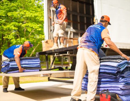 moving professionals loading a truck while providing services like Full-Service Movers, Interstate Movers, Local Movers, and Moving Company Serving Duluth, GA